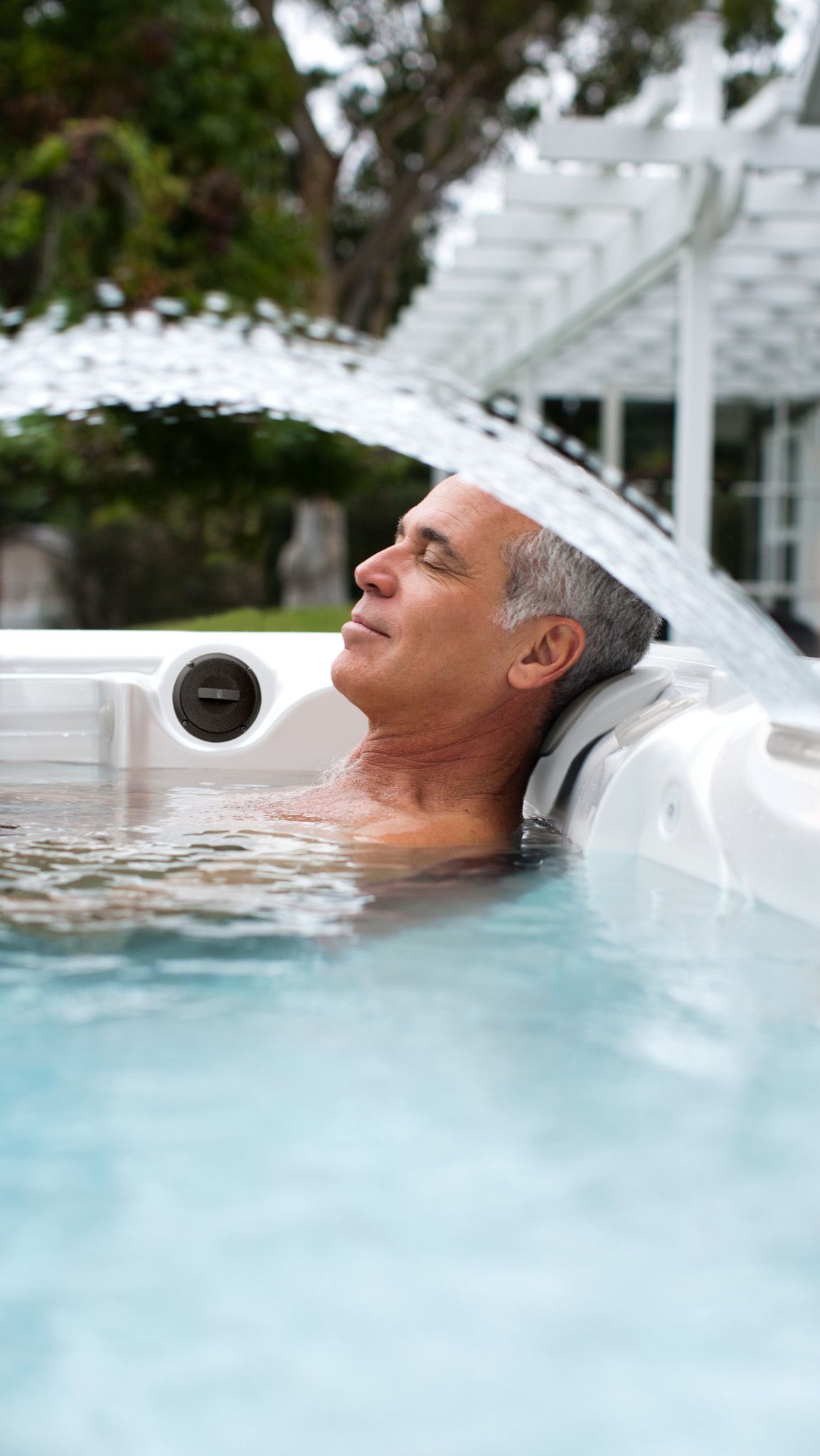 Caldera-Paradise-2016-Makena-Pearl-Espresso-Lifestyle-Older Man 1 | Young's Hot Tub Sales and Service Center