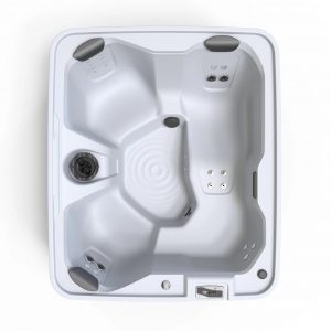 Top-down view of a white rectangular hot tub with multiple molded seats, built-in jets, and a control panel on the edge.