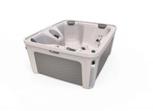 Beige freestanding hot tub with built-in seating, multiple massage jets, and a digital control panel seen from above.